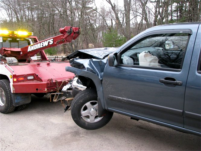 Car being towed after accident