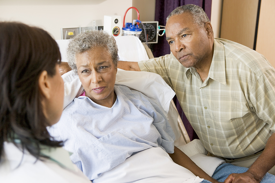 Woman in Hospital Bed with Husband